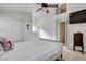 Well-lit bedroom with neutral walls and a cozy atmosphere, featuring a ceiling fan at 3913 Cutting Horse Ave, North Las Vegas, NV 89032
