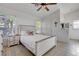 Bright bedroom featuring a queen bed, ceiling fan, and windows that let in natural light at 3913 Cutting Horse Ave, North Las Vegas, NV 89032