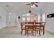 Welcoming dining area with seating for six, tiled floors, and an open view into the kitchen at 3913 Cutting Horse Ave, North Las Vegas, NV 89032