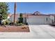 Charming single-story home with a tile roof, low-maintenance landscaping, and an attached two-car garage at 3913 Cutting Horse Ave, North Las Vegas, NV 89032