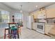 Kitchen features a cozy breakfast nook, granite countertops, and white appliances at 3913 Cutting Horse Ave, North Las Vegas, NV 89032