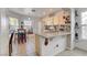 Bright kitchen featuring granite countertops, modern appliances, and a cozy breakfast bar area at 3913 Cutting Horse Ave, North Las Vegas, NV 89032