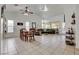 Open-concept living room boasts tile flooring, high ceilings, abundant natural light, and comfortable seating at 3913 Cutting Horse Ave, North Las Vegas, NV 89032