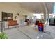 Spacious covered patio with ample seating, offering a perfect outdoor relaxation space at 3913 Cutting Horse Ave, North Las Vegas, NV 89032