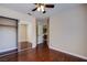 Bedroom featuring hardwood floors, ceiling fan and mirrored closet at 3953 Broad Meadow Ct, Las Vegas, NV 89129