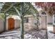 Charming courtyard featuring a wooden gate and overhead trellis at 3953 Broad Meadow Ct, Las Vegas, NV 89129