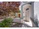 Inviting front entrance with a covered walkway and mature landscaping at 3953 Broad Meadow Ct, Las Vegas, NV 89129