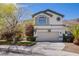 Two-story home featuring a well-manicured yard, two-car garage, and a neutral color scheme at 3953 Broad Meadow Ct, Las Vegas, NV 89129