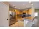 Spacious kitchen featuring stainless steel appliances, light wood cabinetry, and tiled floors at 3953 Broad Meadow Ct, Las Vegas, NV 89129