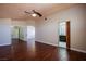 Spacious main bedroom featuring hardwood floors, a ceiling fan, and an ensuite bathroom at 3953 Broad Meadow Ct, Las Vegas, NV 89129