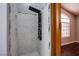 Modern walk-in shower with multiple shower heads and tiled walls and a decorative niche at 3953 Broad Meadow Ct, Las Vegas, NV 89129