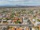 Expansive aerial view showcases the neighborhood with diverse single-Gathering homes and scenic mountain backdrop at 423 Golden Valley Dr, Henderson, NV 89002