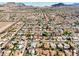 Extensive aerial view of a well-planned residential community with winding roads surrounded by mountains, offering a serene atmosphere at 423 Golden Valley Dr, Henderson, NV 89002