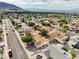 Elevated view of a neighborhood street showing well-maintained homes and mature trees, presenting a peaceful residential setting at 423 Golden Valley Dr, Henderson, NV 89002