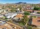 Bird's eye view of single-story homes featuring covered patios and block fences surrounded by desert vegetation at 423 Golden Valley Dr, Henderson, NV 89002