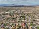 Wide aerial shot showing an extensive residential community with mountain views providing a sense of vast suburban living at 423 Golden Valley Dr, Henderson, NV 89002