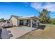 Backyard with a covered patio and landscaping with vehicle parked nearby at 423 Golden Valley Dr, Henderson, NV 89002