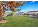 Spacious backyard with a green lawn and shaded patio for outdoor enjoyment at 423 Golden Valley Dr, Henderson, NV 89002