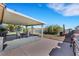 A shaded patio area perfect for entertaining with a grill and outdoor seating at 423 Golden Valley Dr, Henderson, NV 89002