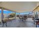 Covered backyard patio with seating and an outdoor grilling area at 423 Golden Valley Dr, Henderson, NV 89002