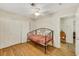 Cozy bedroom with hardwood floors and a ceiling fan above a charming daybed at 423 Golden Valley Dr, Henderson, NV 89002
