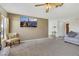 Spacious living room with fireplace, ceiling fan, and large windows that provide lots of light at 423 Golden Valley Dr, Henderson, NV 89002