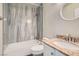 Tiled shower with tub and granite sink at 423 Red Canvas Pl, Las Vegas, NV 89144