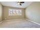 Bedroom featuring neutral tones, carpet flooring, and plantation shutters allowing natural light to filter through at 423 Red Canvas Pl, Las Vegas, NV 89144