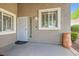 Inviting front entrance with a stylish security door, decorative pot, and well-maintained landscaping at 423 Red Canvas Pl, Las Vegas, NV 89144