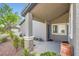 Inviting front entrance featuring stone columns and desert landscaping, with a decorative pot at the door at 423 Red Canvas Pl, Las Vegas, NV 89144