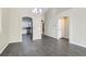 Open living space with modern flooring, neutral paint, and arched doorway to kitchen at 423 Red Canvas Pl, Las Vegas, NV 89144