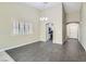 Open living space with modern flooring, neutral paint, and arched doorway to entry at 423 Red Canvas Pl, Las Vegas, NV 89144