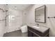 Modern bathroom with walk-in shower, sleek vanity with dark wood cabinets, and elegant gray tilework throughout at 4471 Dean Martin Dr # 1210, Las Vegas, NV 89103