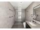 Elegant bathroom showcasing a walk-in shower with mosaic tiling, a floating vanity, and contemporary fixtures at 4471 Dean Martin Dr # 1210, Las Vegas, NV 89103