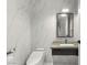 Modern bathroom featuring marble walls, a sleek vanity, and contemporary fixtures at 4471 Dean Martin Dr # 1210, Las Vegas, NV 89103