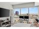 Bright bedroom with city view featuring large windows and a dedicated computer workspace at 4471 Dean Martin Dr # 1210, Las Vegas, NV 89103