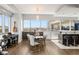Open floor plan with dining table near floor-to-ceiling windows, city views, and modern decor at 4471 Dean Martin Dr # 1210, Las Vegas, NV 89103