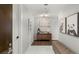 Modern hallway featuring neutral walls, artwork and a seating bench at 4471 Dean Martin Dr # 1210, Las Vegas, NV 89103