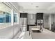 Kitchen featuring stainless steel appliances, a modern backsplash and island with sink at 4471 Dean Martin Dr # 1210, Las Vegas, NV 89103