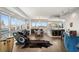 Open-concept living space featuring floor-to-ceiling windows with great views, a dining area, and a kitchen with breakfast bar at 4471 Dean Martin Dr # 1210, Las Vegas, NV 89103