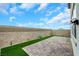 The home has a small backyard with well-placed pavers and artificial turf at 5016 Kaslo Ave, Las Vegas, NV 89139