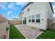 The home has a small backyard with well-placed pavers, artificial turf, and a sliding glass door at 5016 Kaslo Ave, Las Vegas, NV 89139