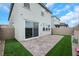 The home has a small backyard with well-placed pavers, artificial turf, and a sliding glass door at 5016 Kaslo Ave, Las Vegas, NV 89139