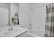 Bright bathroom with a full tub and shower combo, featuring modern fixtures and vanity at 5016 Kaslo Ave, Las Vegas, NV 89139