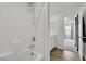 Clean bathroom with a full tub and shower combo, featuring modern fixtures and tile at 5016 Kaslo Ave, Las Vegas, NV 89139
