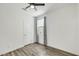 Comfortable bedroom featuring hard wood floors, a modern ceiling fan, and a large window at 5016 Kaslo Ave, Las Vegas, NV 89139
