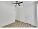 Simple bedroom with hard wood floors, a ceiling fan and bright white walls at 5016 Kaslo Ave, Las Vegas, NV 89139