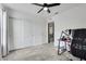 Bedroom with a closet and fan, set up as an office with a desk and chair at 5016 Kaslo Ave, Las Vegas, NV 89139