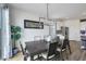 Cozy dining room with contemporary decor, a large window and table with seating for six at 5016 Kaslo Ave, Las Vegas, NV 89139