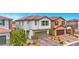 Exterior view of a two-story home featuring a tile roof and manicured landscaping at 5016 Kaslo Ave, Las Vegas, NV 89139